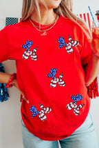Red patriotic graphic tee with sequin balloon puppy designs in stars and stripes, styled with denim for Independence Day from The Pink Doxie Boutique.