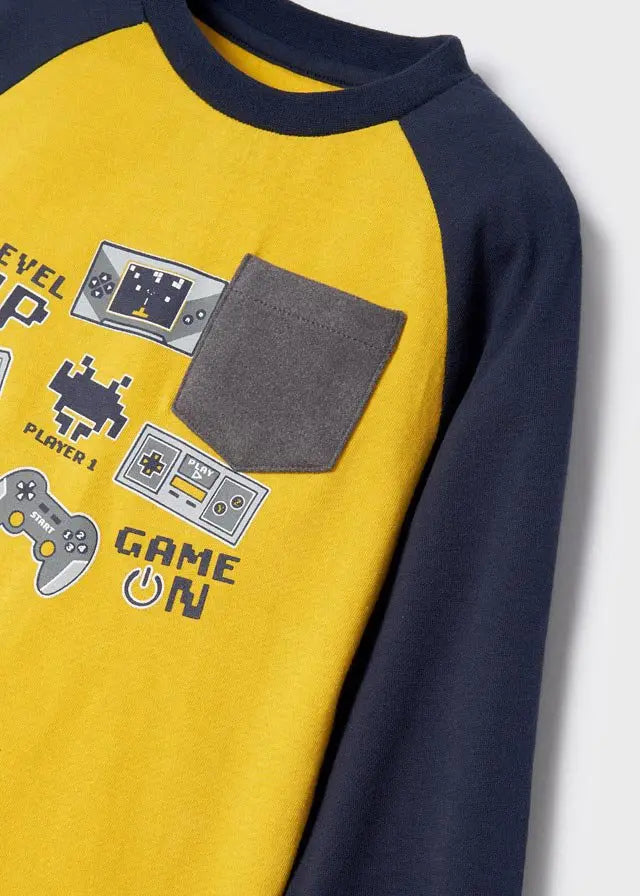 Close-up of the game graphic and chest pocket on the Oro print pajama top