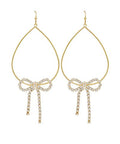 Gold teardrop earrings with sparkling crystal bow accents and dangling crystal details displayed on a white background from The Pink Doxie Boutique.