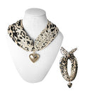 Leopard scarf necklace with gold heart charm on display bust