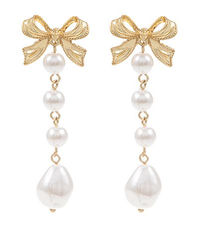 Gold bow drop earrings with linked faux pearl accents on a white background from The Pink Doxie Boutique.