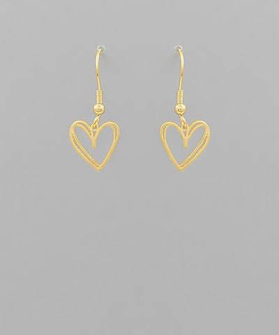 Gold metal heart drop earrings with fish hook closure displayed on a neutral background from The Pink Doxie Boutique.