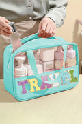Mint green clear PVC makeup bag with chenille TRAVEL lettering and top handles, filled with beauty products, from The Pink Doxie Boutique.
