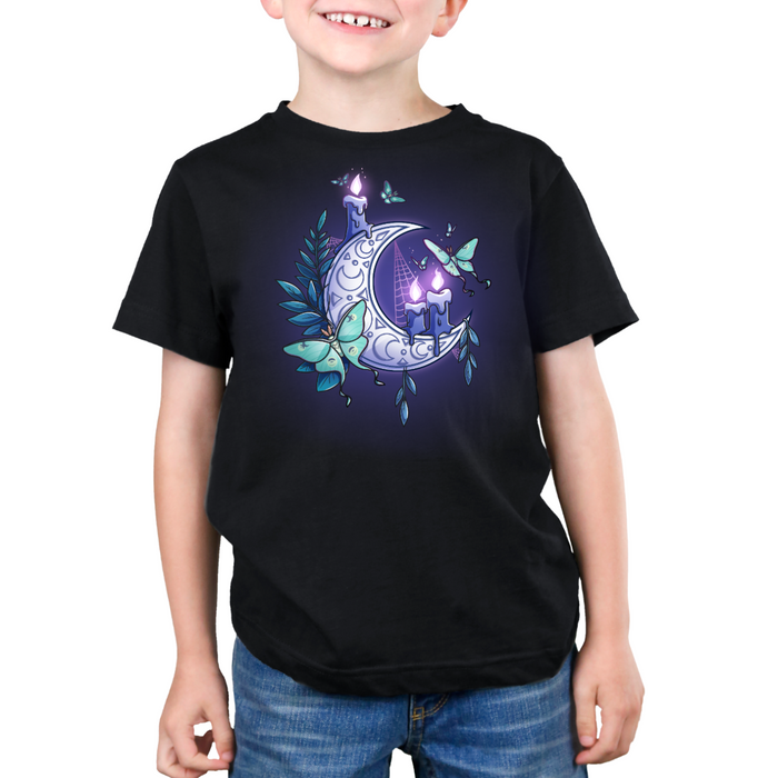 Premium Cotton T-shirt_TeeTurtle black Moonlit Luna Premium Cotton T-shirt featuring a glowing purple crescent moon adorned with candles, a luna moth, and delicate fern leaves in a mystical nighttime design.