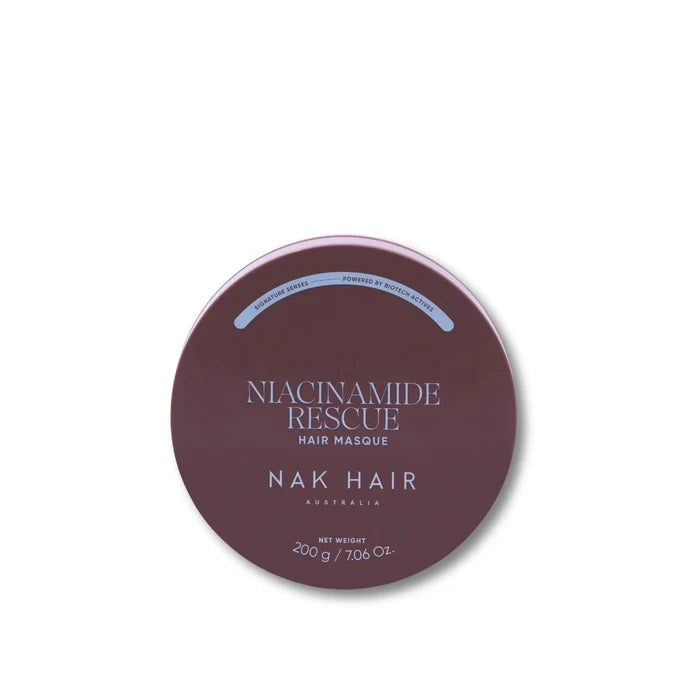 A round tin of NAK HAIR Niacinamide Rescue Hair Masque in a dusty mauve-brown shade, shown on a clean white background.