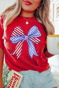 Red patriotic graphic T-shirt with large American flag bow print, styled casually for Fourth of July from The Pink Doxie Boutique.