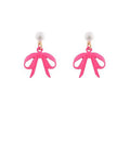 Pink bow drop earrings with faux pearl studs displayed on a white background from The Pink Doxie Boutique.