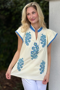Ivory embroidered floral top with blue stitching