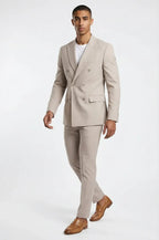 Beige Double Breasted 2-Piece Suit – a refined beige ensemble crafted in a premium Italian wool blend, featuring a bespoke tailored double-breasted blazer and matching trousers for a sharp, structured silhouette and timeless sophistication.