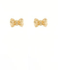 Gold textured bow stud earrings on a white background from The Pink Doxie Boutique.