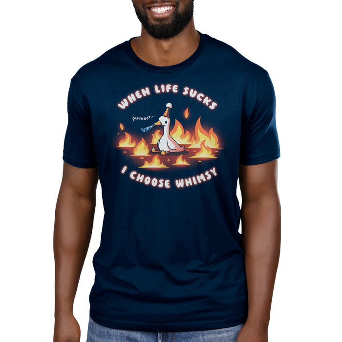 Premium Cotton T-shirt_TeeTurtle navy When Life Sucks I Choose Whimsy Premium Cotton T-shirt featuring a goose with a party hat and a noisemaker sitting surrounded by fire. The text reads "When Life Sucks I choose Whimsy" with "pweeeet" as the sound of the noisemaker.